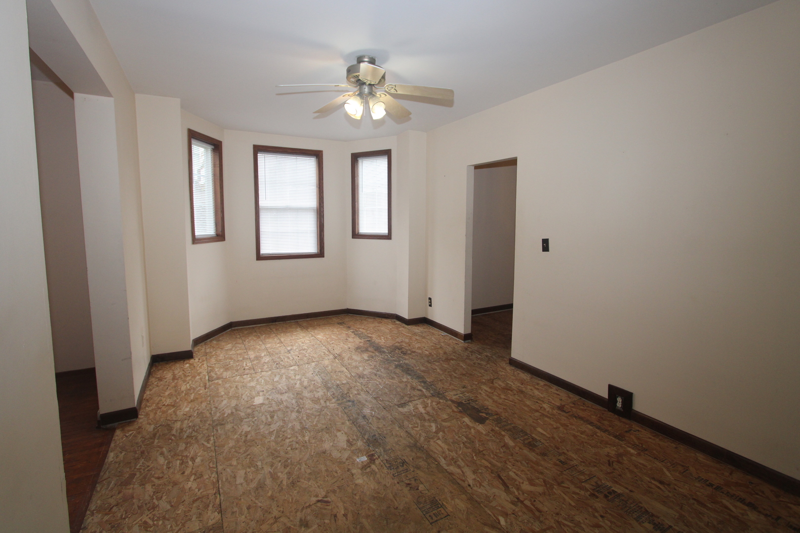 620 Oneida Street Joliet, IL 60435 - Photo 12 of 28 an empty room with windows and fan