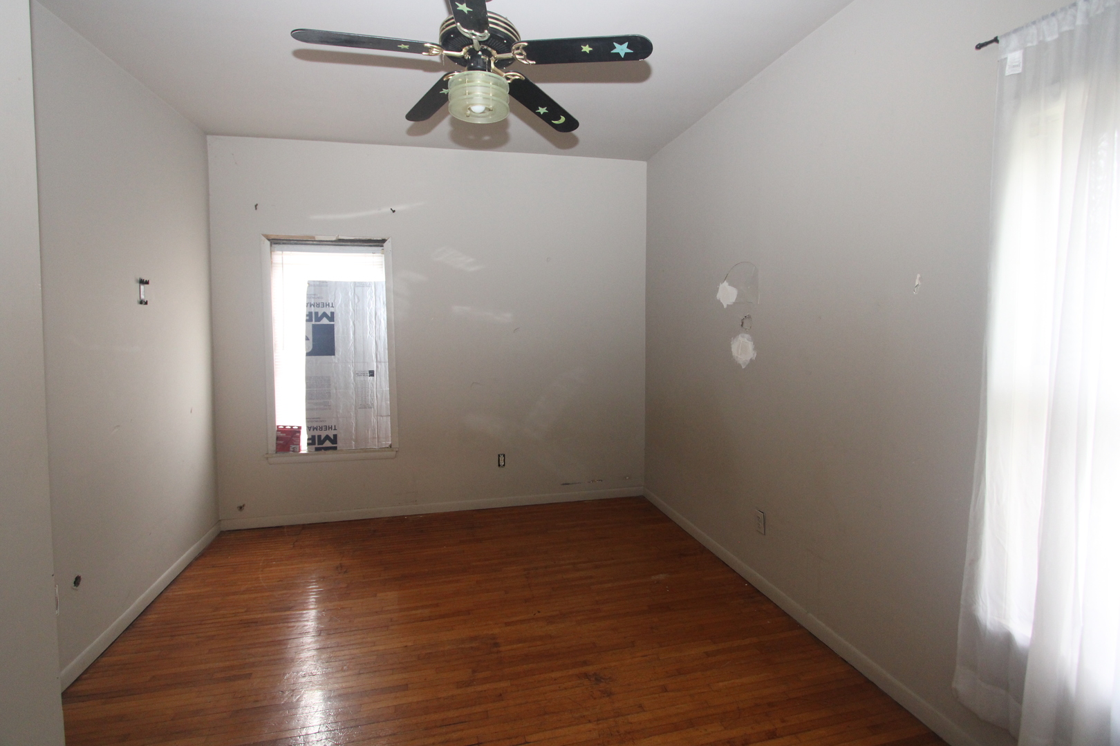 620 Oneida Street Joliet, IL 60435 - Photo 17 of 28 wooden floor in an empty room with a window
