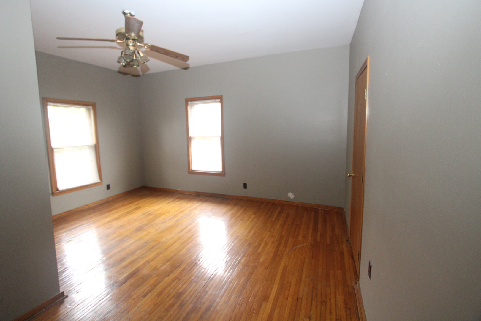 620 Oneida Street Joliet, IL 60435 - Photo 19 of 28 a view of empty room with wooden floor and fan