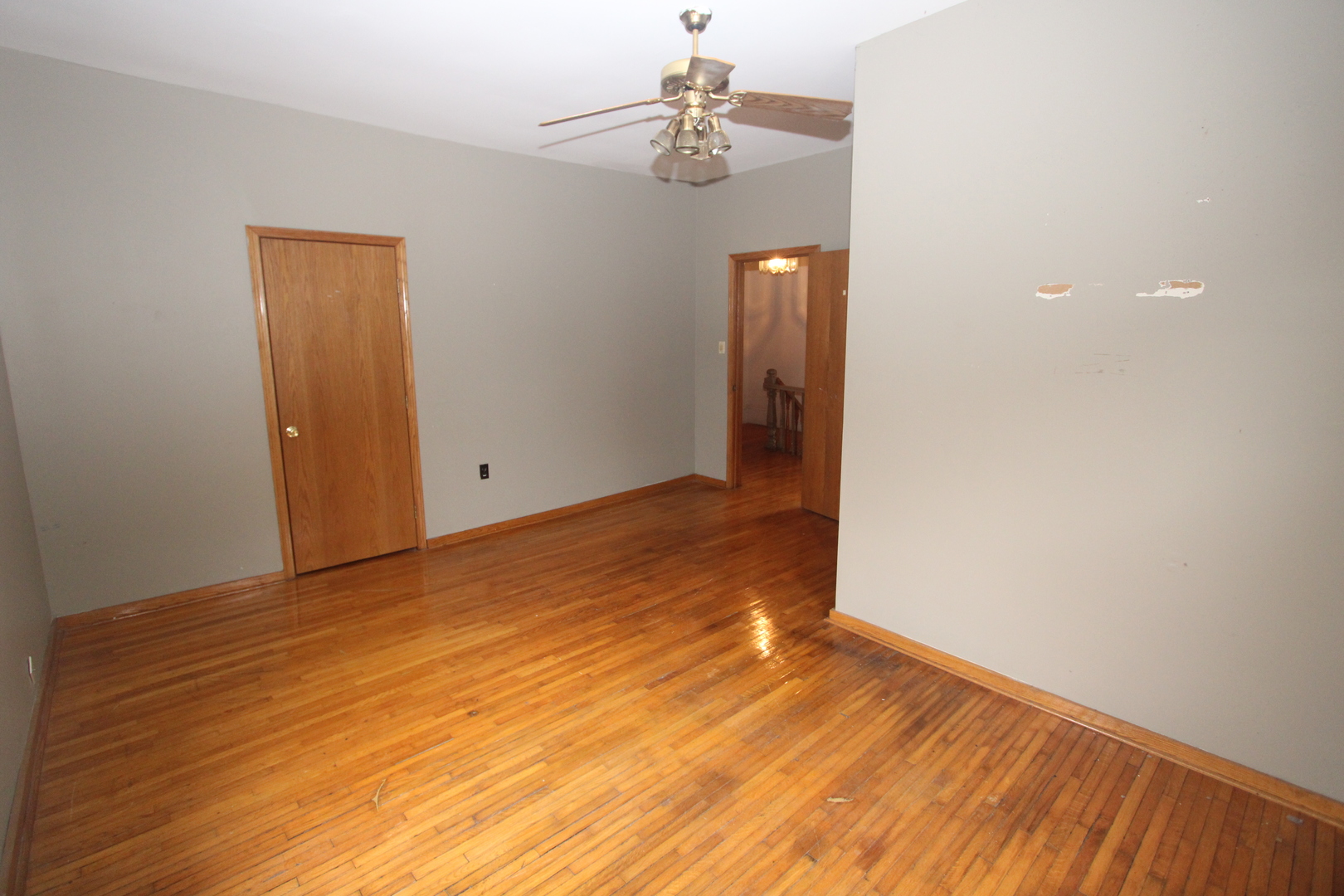 620 Oneida Street Joliet, IL 60435 - Photo 20 of 28 wooden floor in an empty room with a window