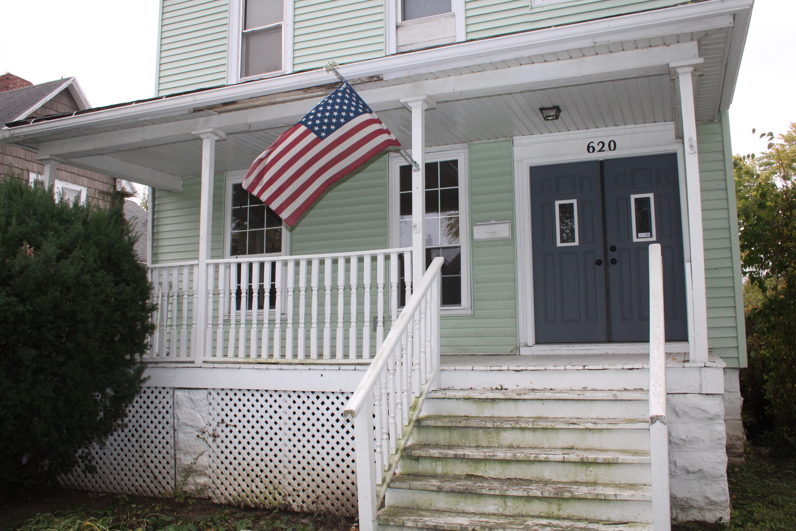 620 Oneida Street Joliet, IL 60435 - Photo 2 of 28 a front view of a house with entryway and stairs