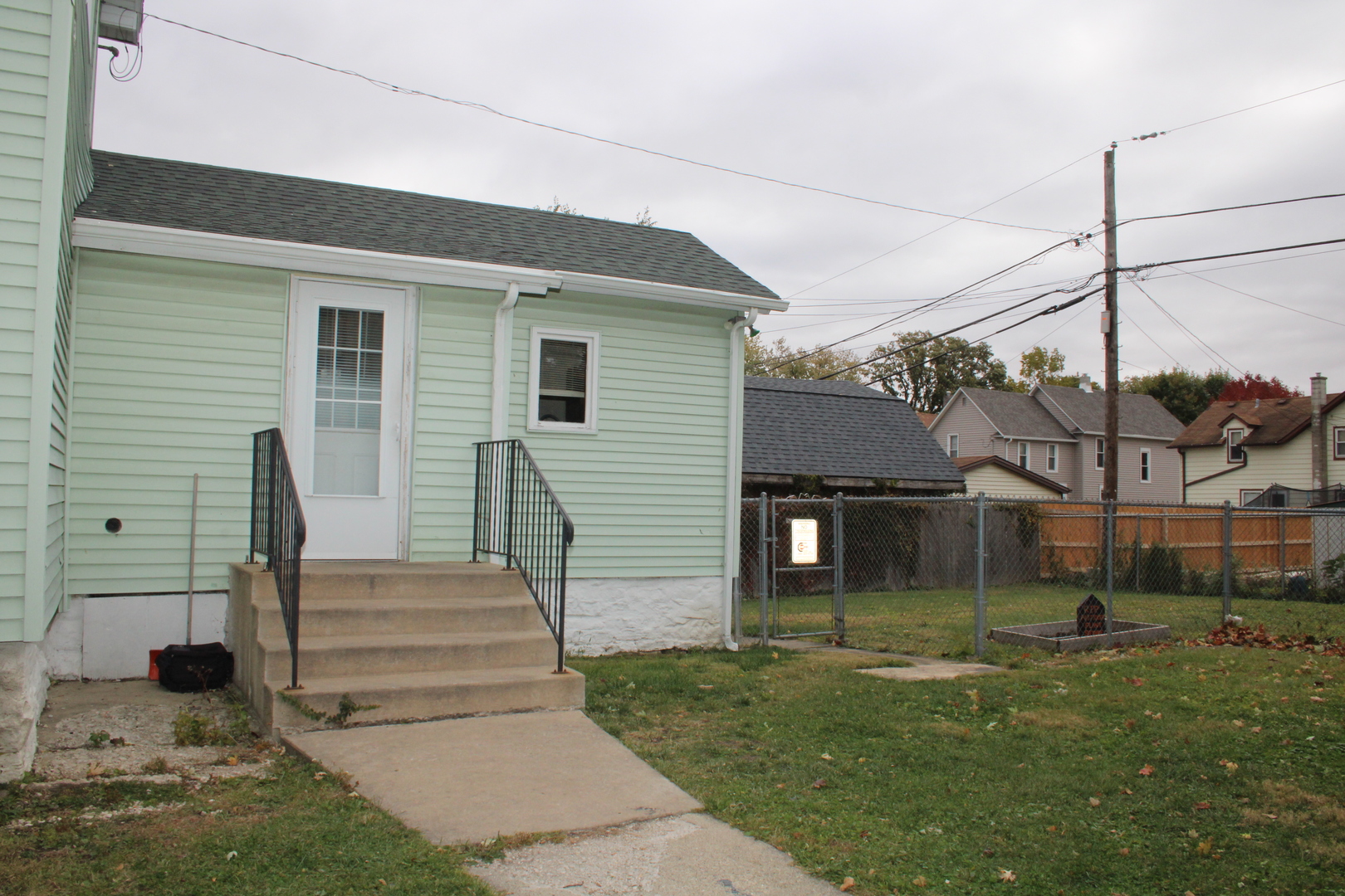 620 Oneida Street Joliet, IL 60435 - Photo 27 of 28 a front view of a house with a garden and plants