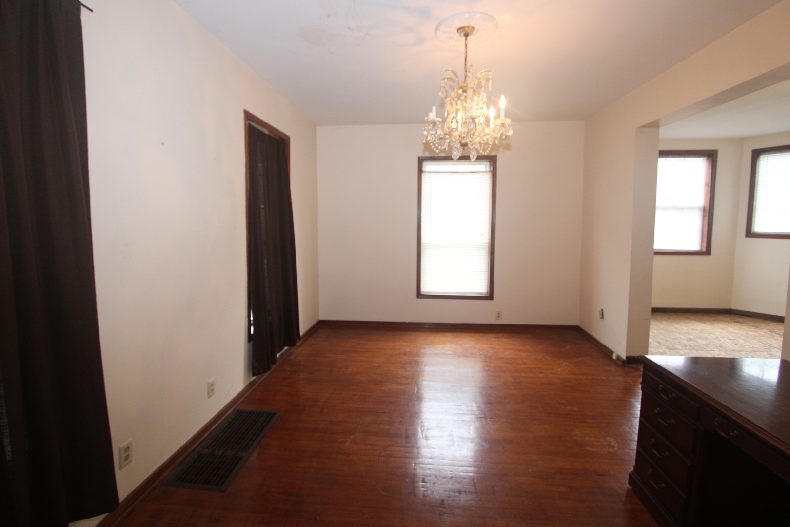 620 Oneida Street Joliet, IL 60435 - Photo 10 of 28 an empty room with wooden floor and windows