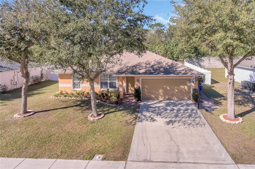 2918 Jebidiah Loop St. Cloud, FL 34772 - Photo 1 of 1 a view of a house with backyard porch and sitting area