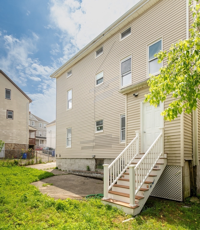50 Tecumseh Street Fall River, MA 02721 - Photo 17 of 36 a view of a house with a yard