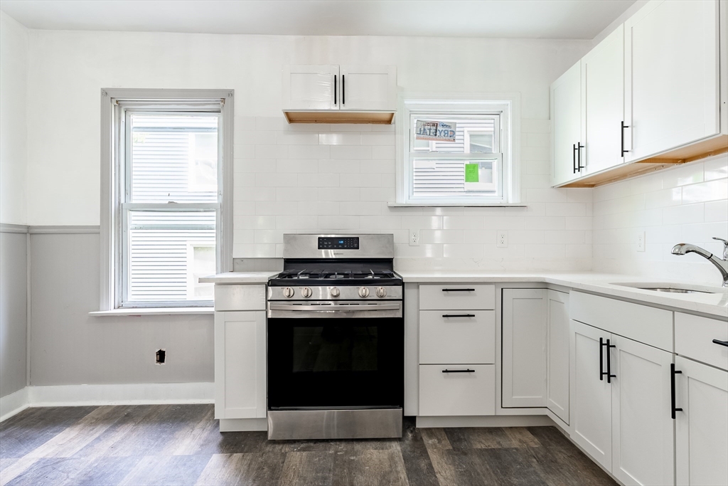 50 Tecumseh Street Fall River, MA 02721 - Photo 2 of 36 a kitchen with cabinets appliances and a window