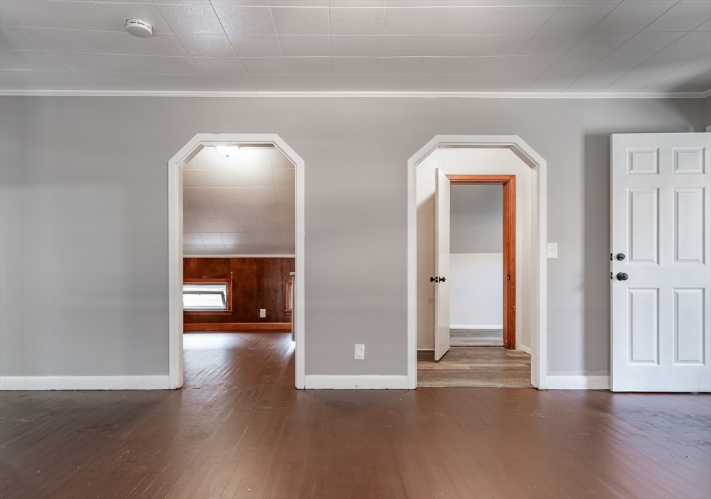 50 Tecumseh Street Fall River, MA 02721 - Photo 25 of 36 an empty room with wooden floor and windows