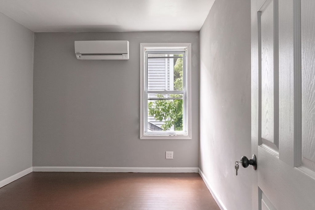 50 Tecumseh Street Fall River, MA 02721 - Photo 26 of 36 a view of an empty room with a window