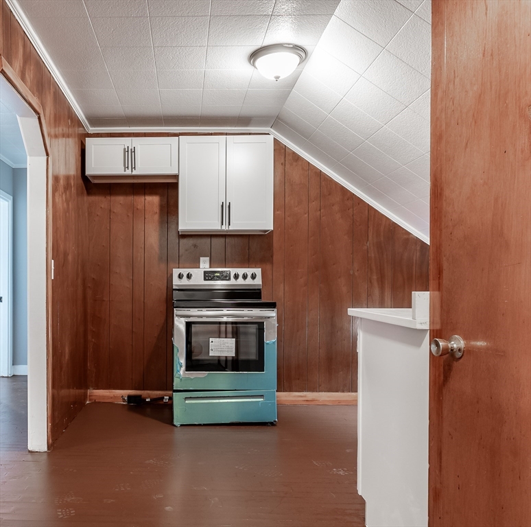 50 Tecumseh Street Fall River, MA 02721 - Photo 27 of 36 a kitchen with stainless steel appliances a refrigerator and a stove