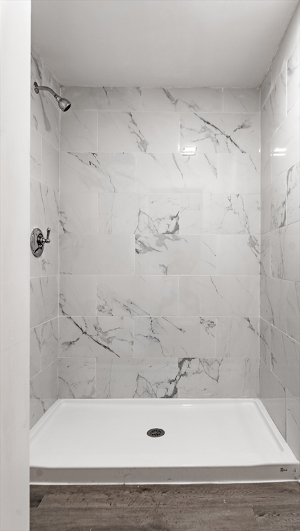 50 Tecumseh Street Fall River, MA 02721 - Photo 31 of 36 a bathroom with a bathtub and a shower