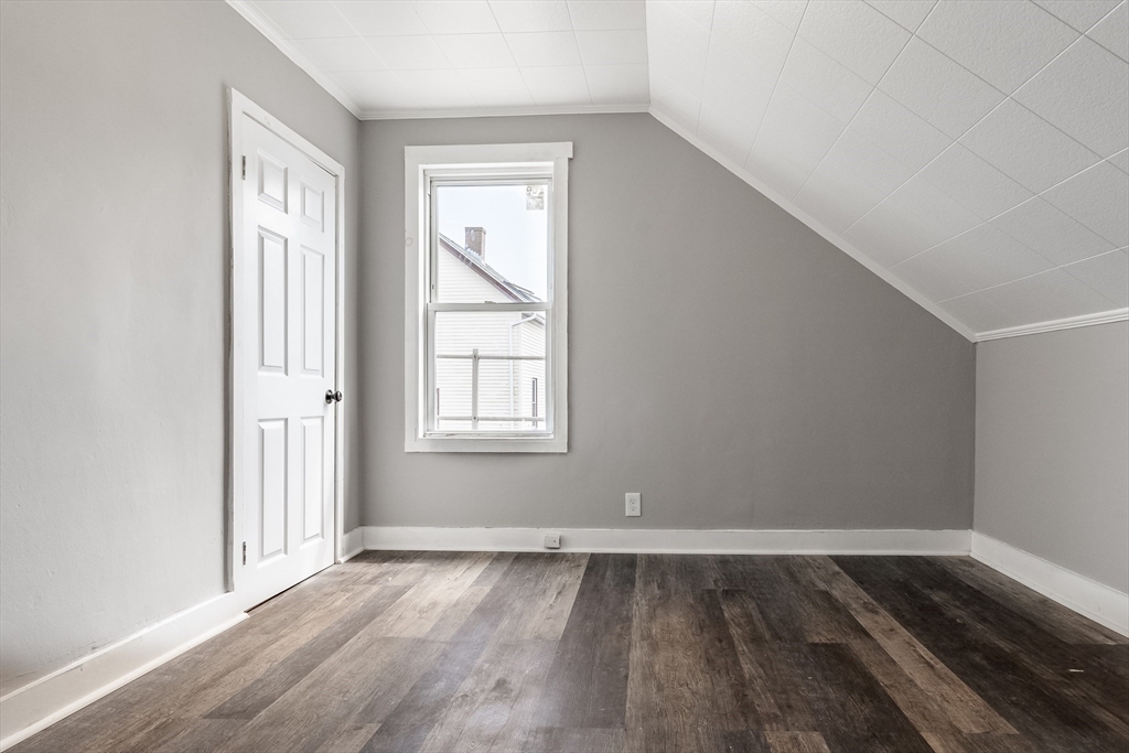 50 Tecumseh Street Fall River, MA 02721 - Photo 35 of 36 an empty room with wooden floor and windows