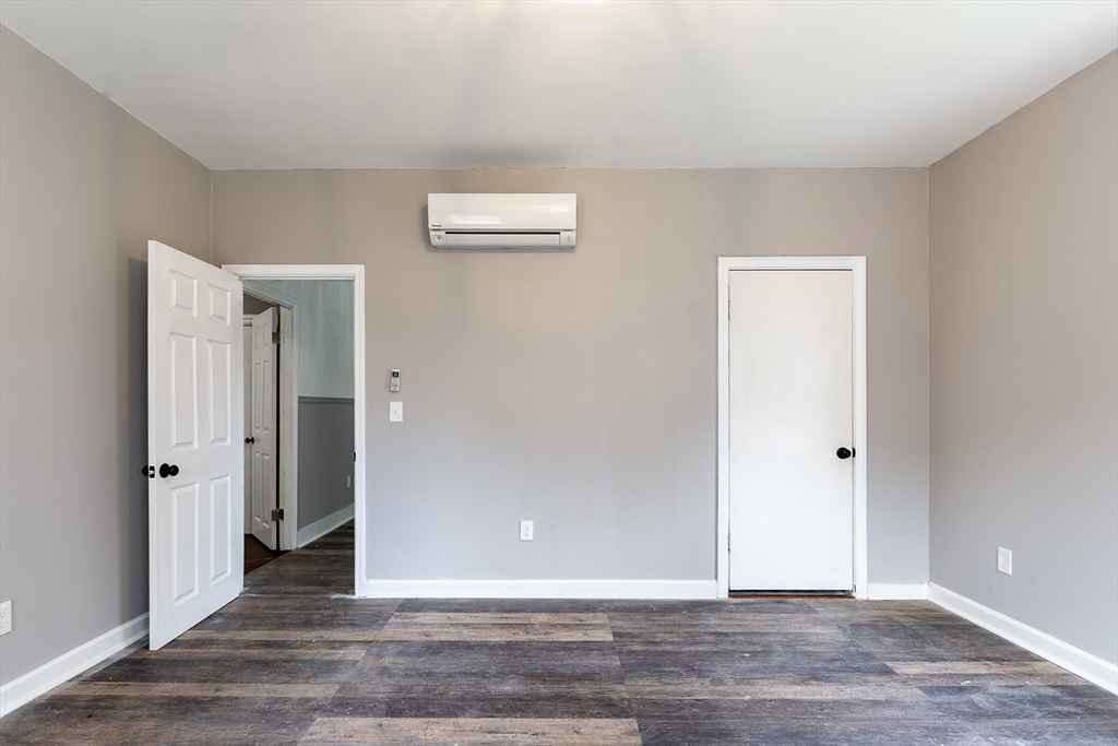 50 Tecumseh Street Fall River, MA 02721 - Photo 6 of 36 an empty room with wooden floor and closet