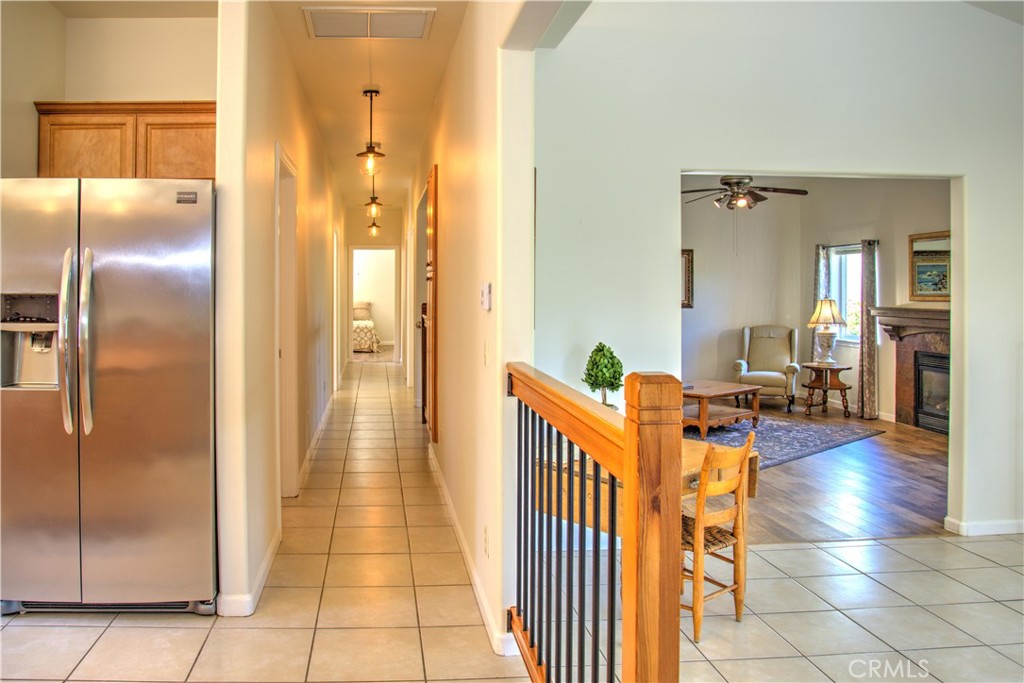 3199 Eton Road Cambria, CA 93428 - Photo 12 of 30 a view of a hallway with wooden floor and dining room view