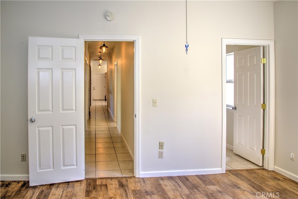 3199 Eton Road Cambria, CA 93428 - Photo 17 of 30 a view of a hallway with wooden floor