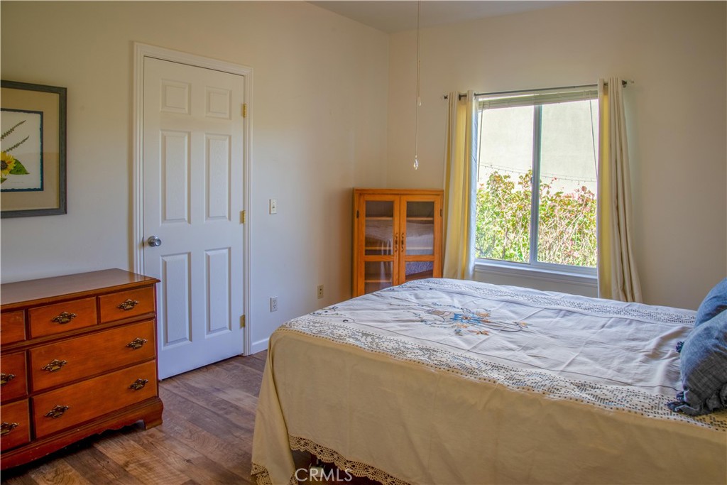 3199 Eton Road Cambria, CA 93428 - Photo 21 of 30 a bedroom with a bed and a dresser