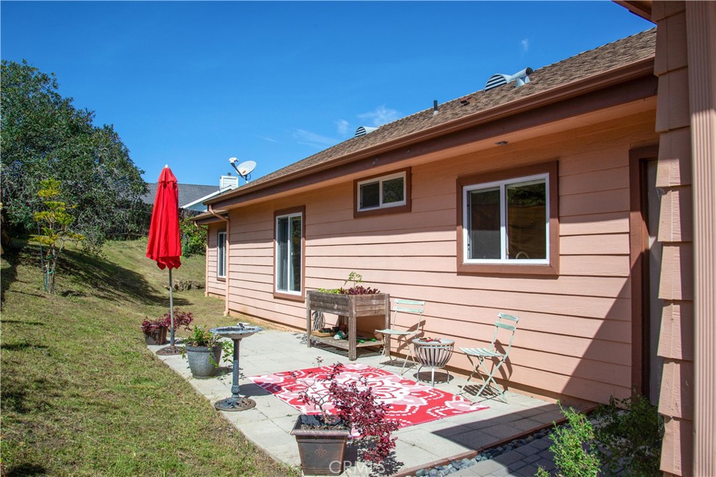 3199 Eton Road Cambria, CA 93428 - Photo 25 of 30 a front view of a house with a yard