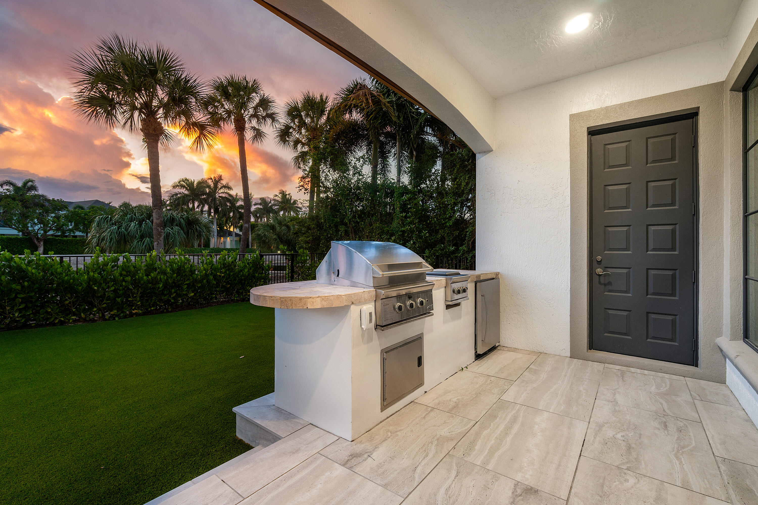 1655 Royal Palm Way Boca Raton, FL 33432 - Photo 72 of 76 a view of a kitchen with a sink and a yard