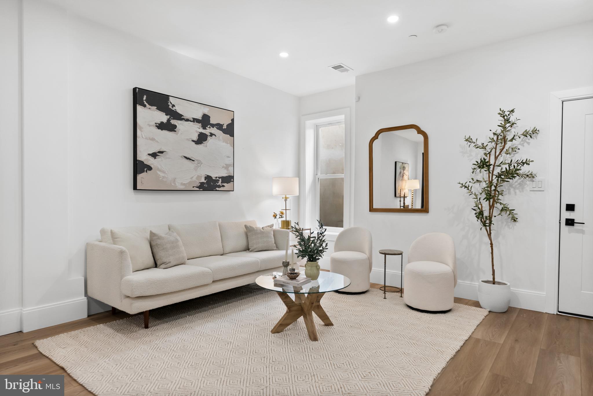 1714 Euclid Street Northwest, Unit 1 Washington, DC 20009 - Photo 5 of 24 a living room with furniture and a potted plant