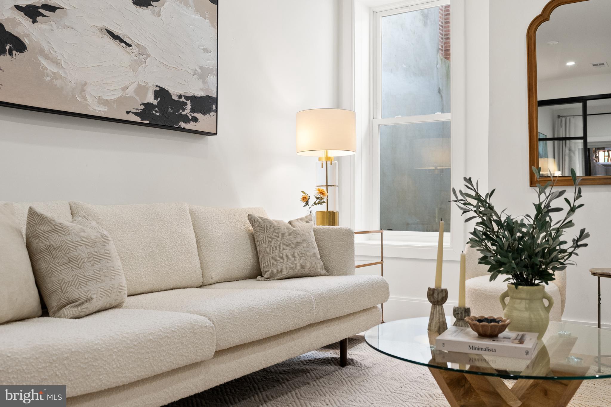 1714 Euclid Street Northwest, Unit 1 Washington, DC 20009 - Photo 7 of 24 a living room with furniture and a lamp