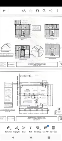 a backyard of apartments with large trees