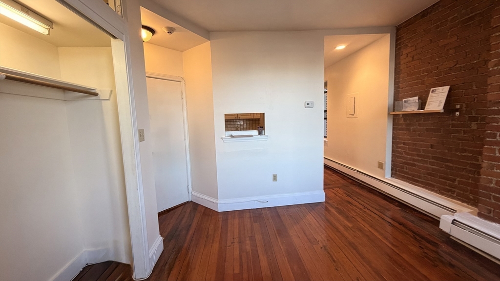 57 Charter Street, Unit 4A Boston, MA 02113 - Photo 3 of 13 a view of front door with wooden floor