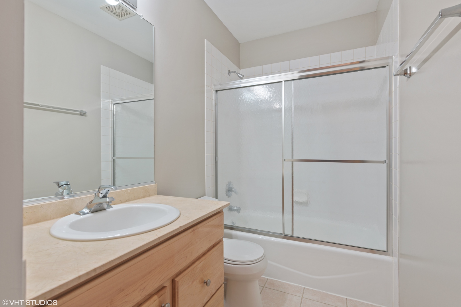927 North Noble Street, Unit 1 Chicago, IL 60642 - Photo 7 of 10 a bathroom with a sink toilet and shower