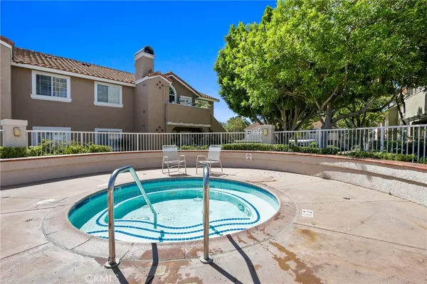 a swimming pool with outdoor seating and yard