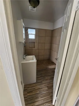 a bathroom with a sink and mirror
