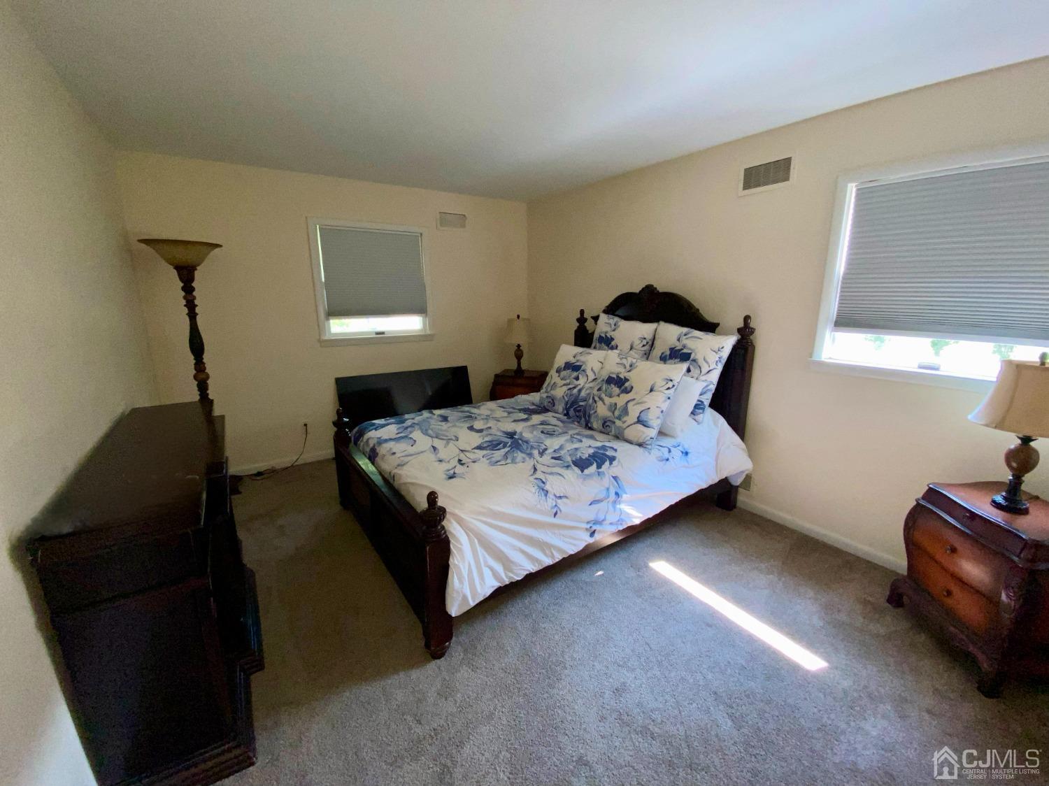 30 Woodland Road Franklin, NJ 07416 - Photo 11 of 34 a bedroom with a bed and a window