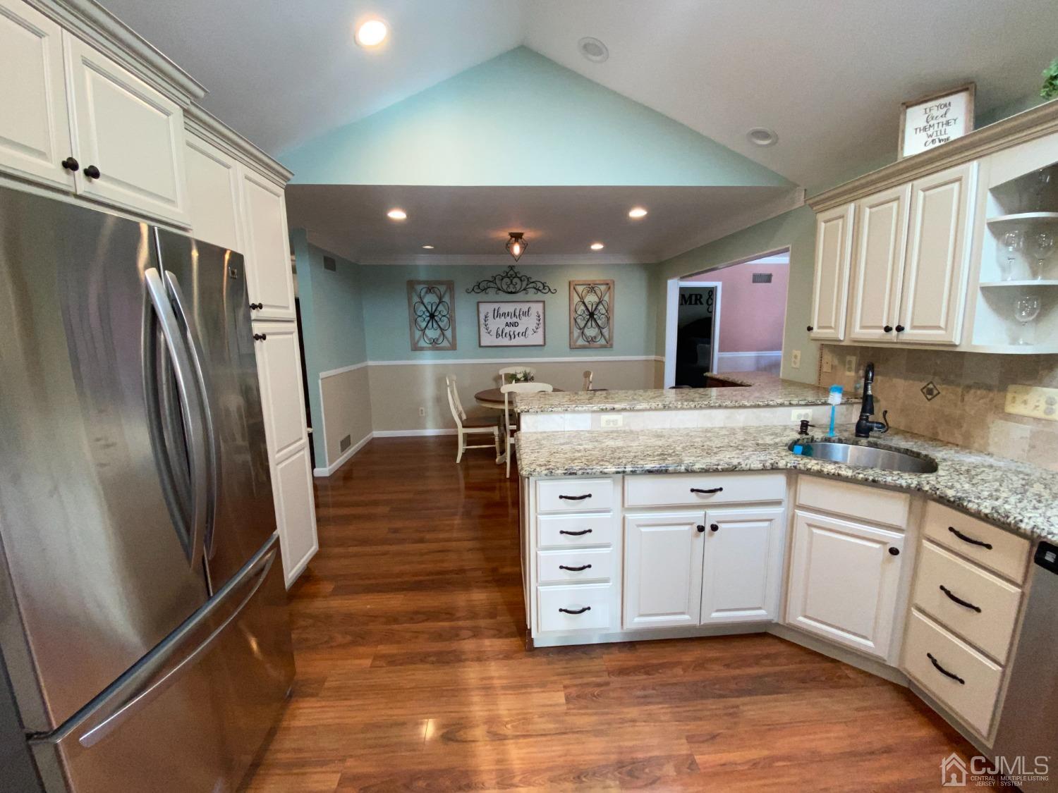 30 Woodland Road Franklin, NJ 07416 - Photo 14 of 34 a kitchen with stainless steel appliances granite countertop a refrigerator and a stove top oven