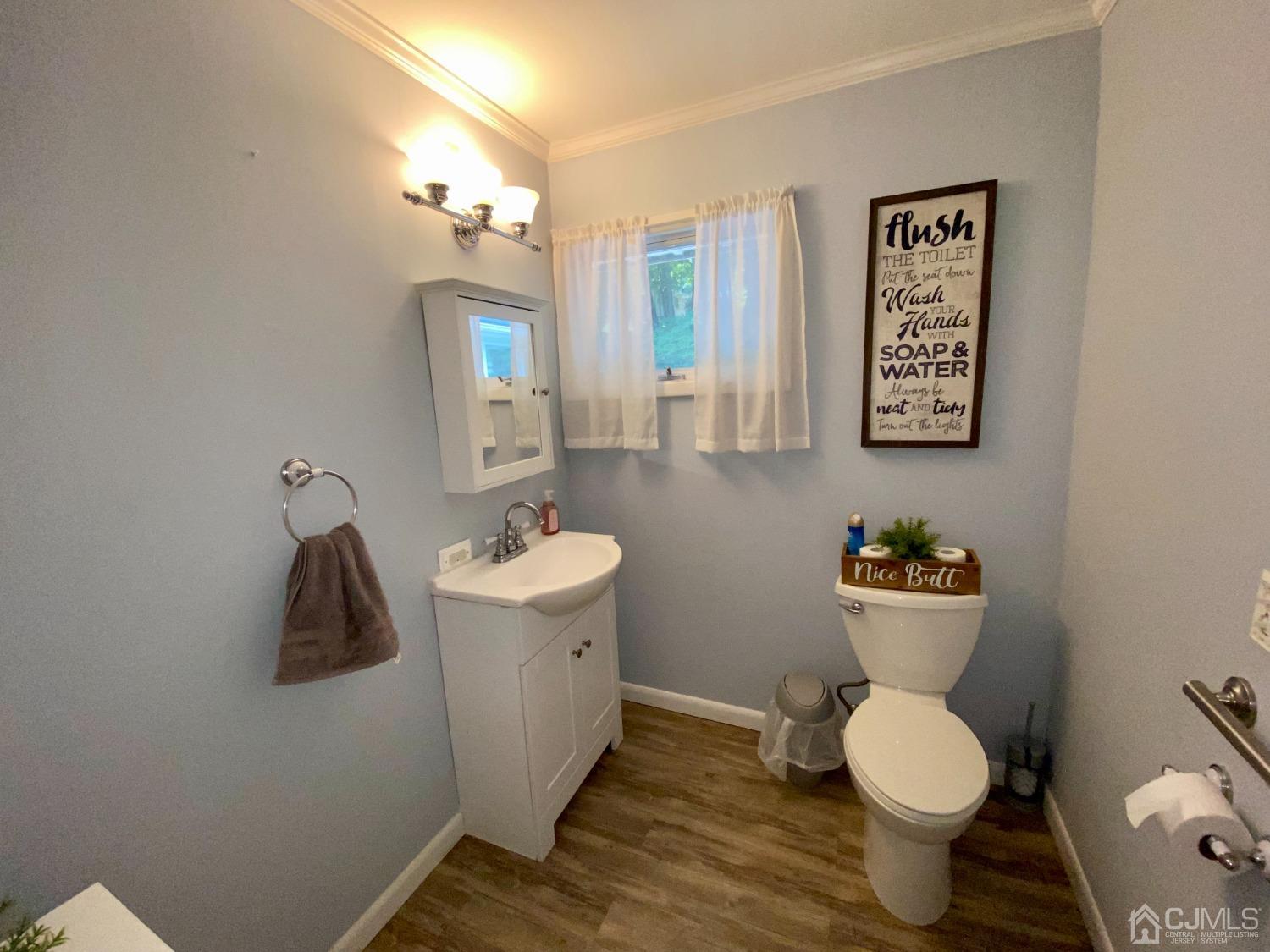 30 Woodland Road Franklin, NJ 07416 - Photo 19 of 34 a bathroom with a toilet sink and mirror