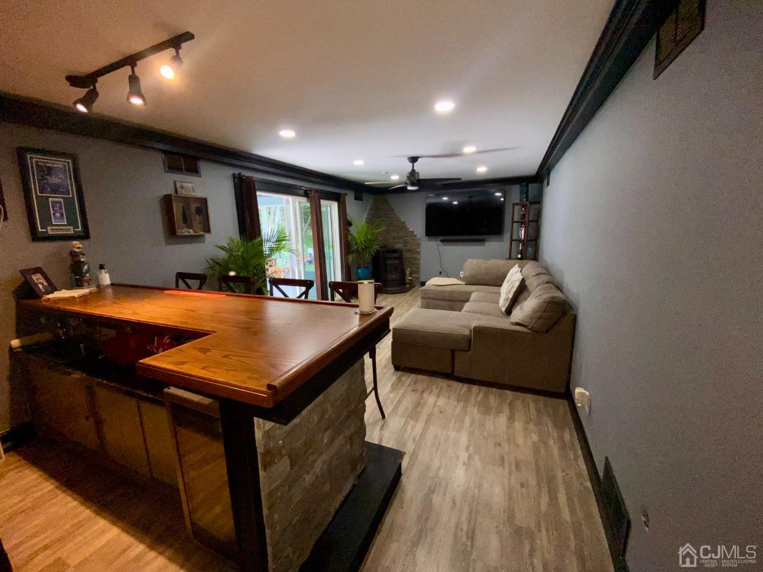 30 Woodland Road Franklin, NJ 07416 - Photo 20 of 34 a living room with furniture a table and chairs