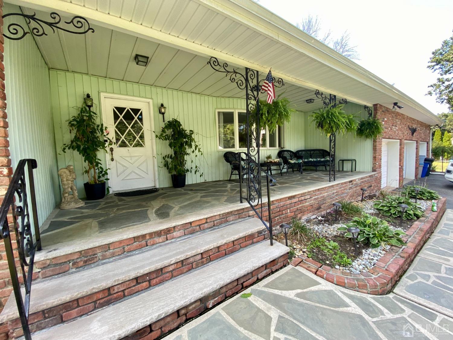 30 Woodland Road Franklin, NJ 07416 - Photo 2 of 34 a view of a house with backyard and sitting area