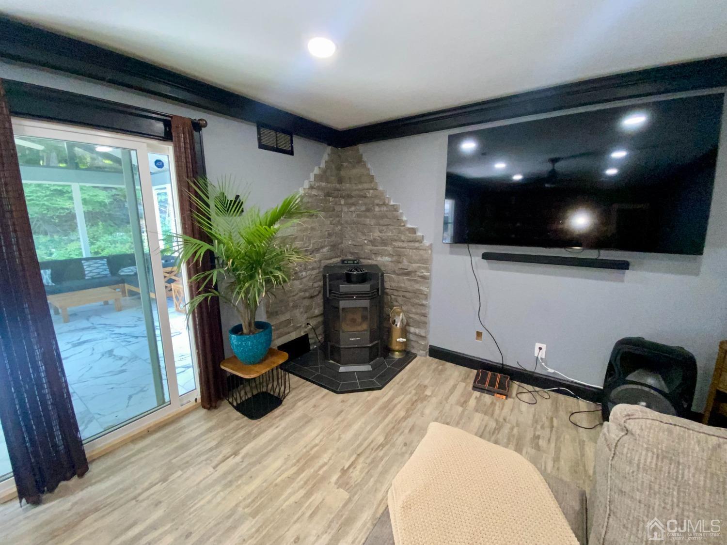30 Woodland Road Franklin, NJ 07416 - Photo 23 of 34 a room with furniture and a fireplace