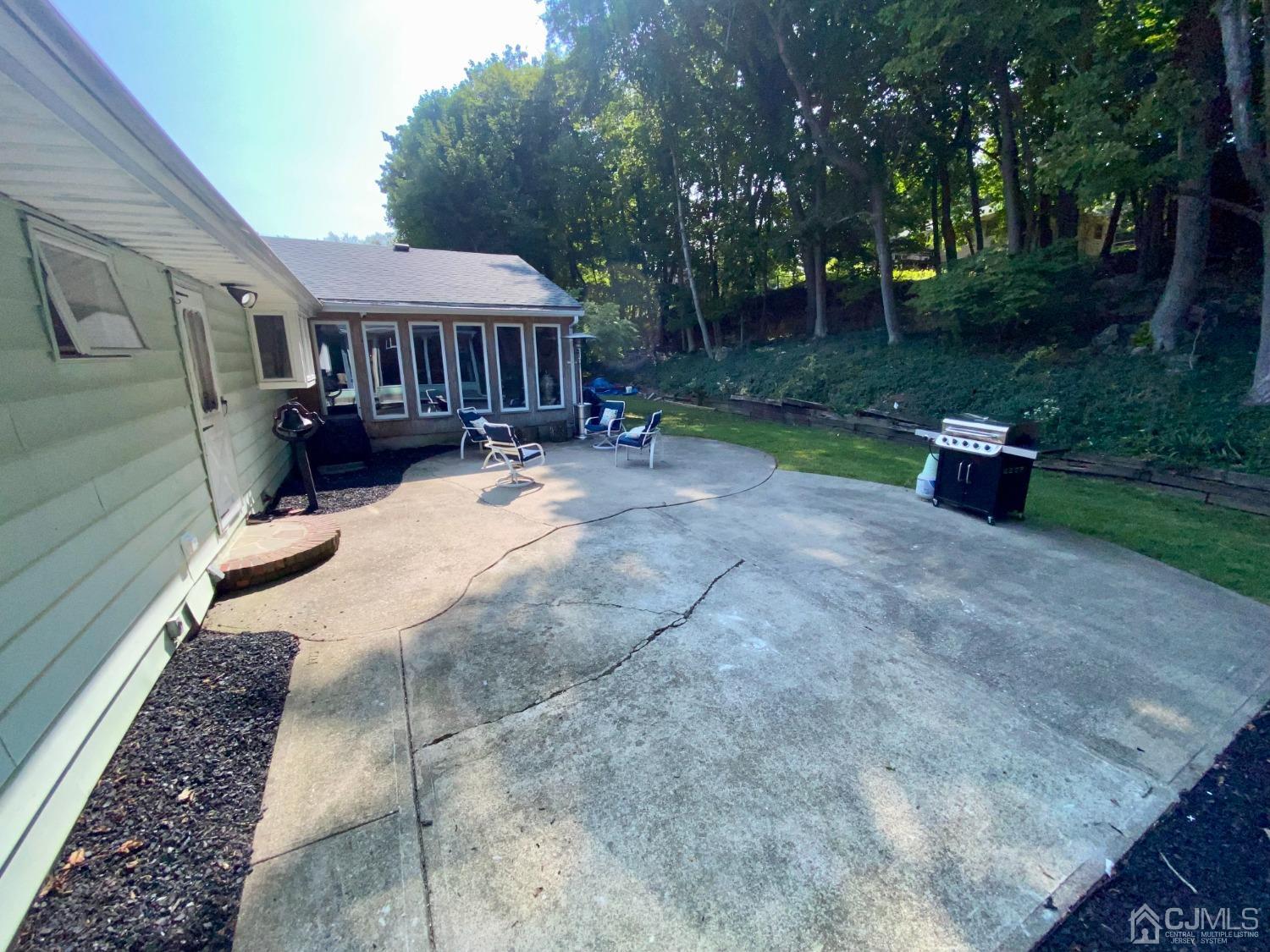 30 Woodland Road Franklin, NJ 07416 - Photo 27 of 34 a view of a house with backyard and sitting area
