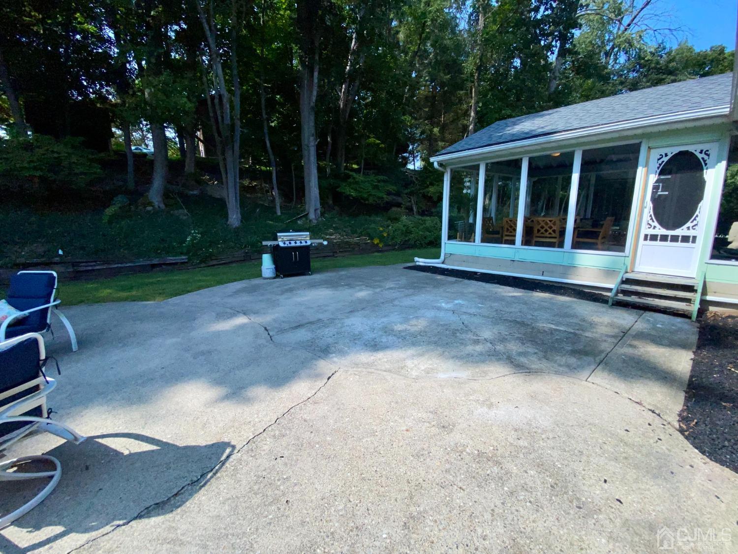 30 Woodland Road Franklin, NJ 07416 - Photo 28 of 34 a view of a house with backyard and garden