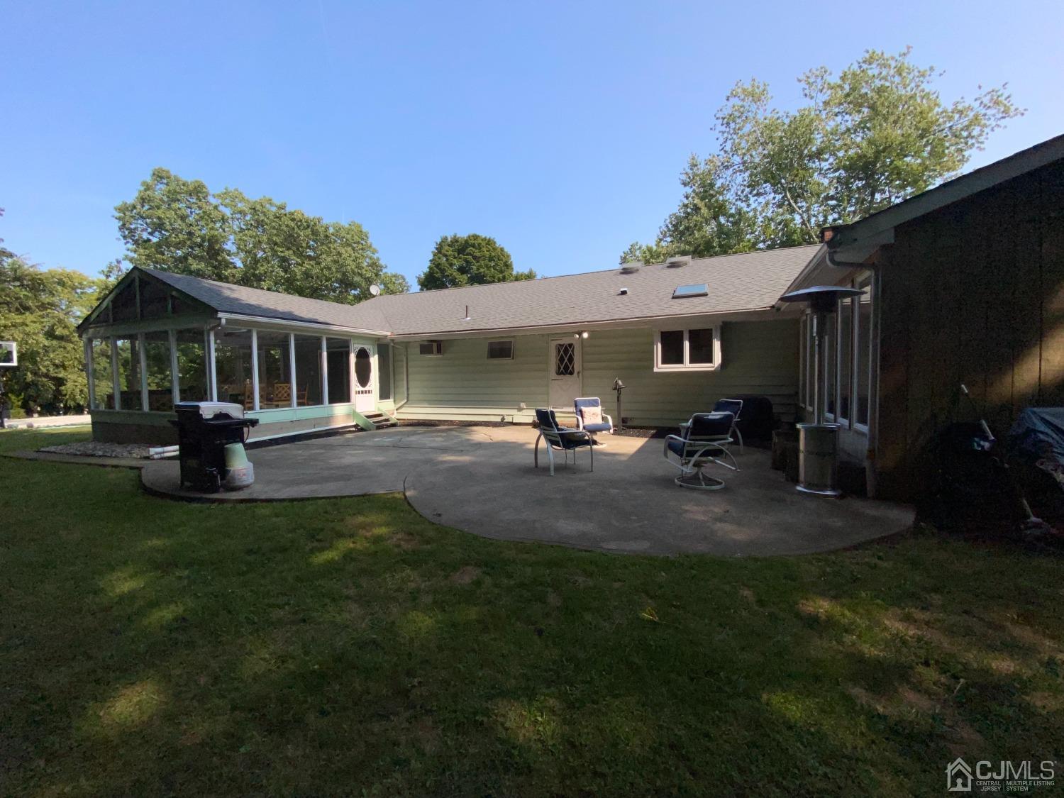 30 Woodland Road Franklin, NJ 07416 - Photo 29 of 34 a view of a house with backyard and sitting area
