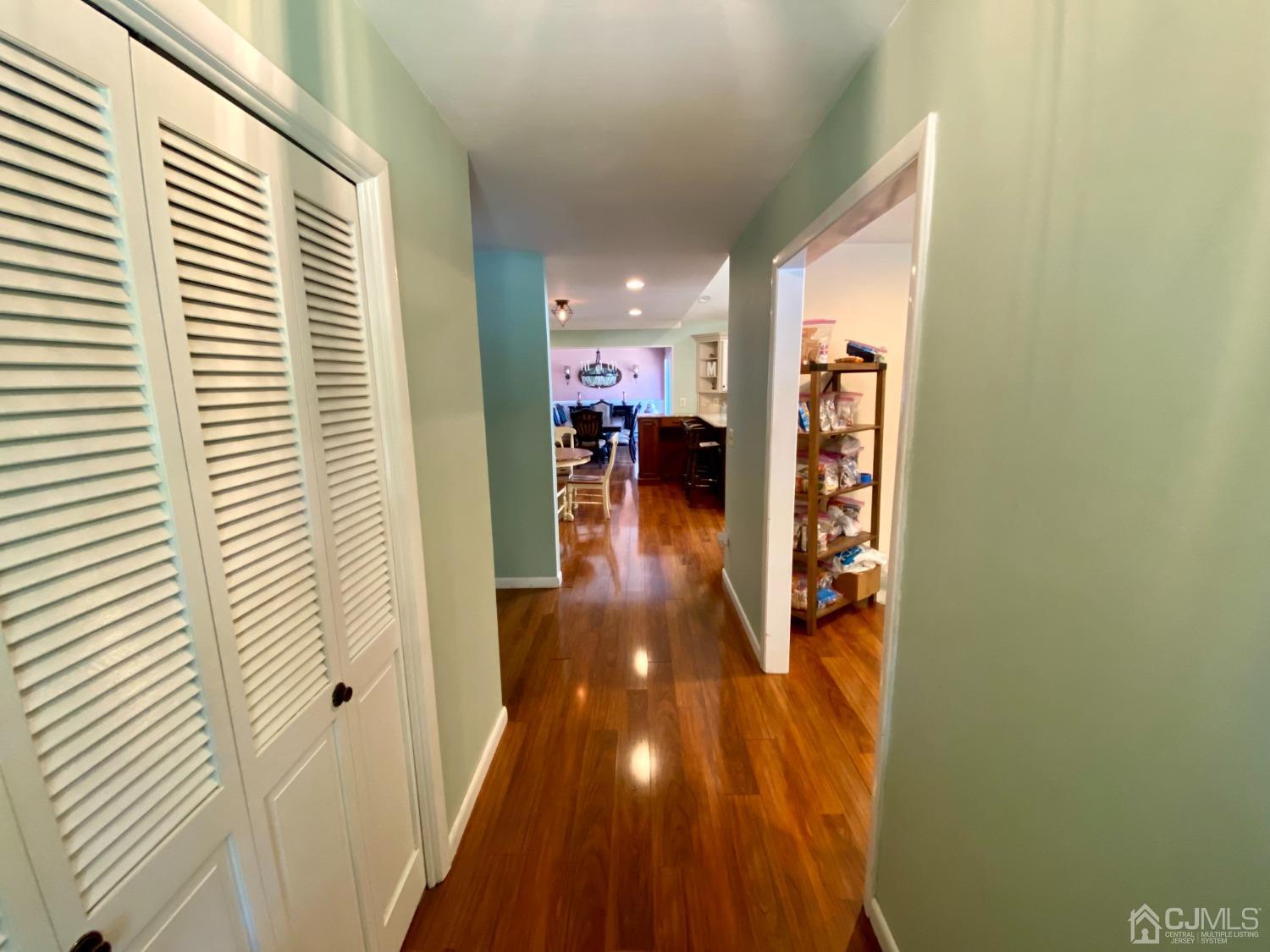 30 Woodland Road Franklin, NJ 07416 - Photo 3 of 34 a view of a hallway with dining area and chandelier