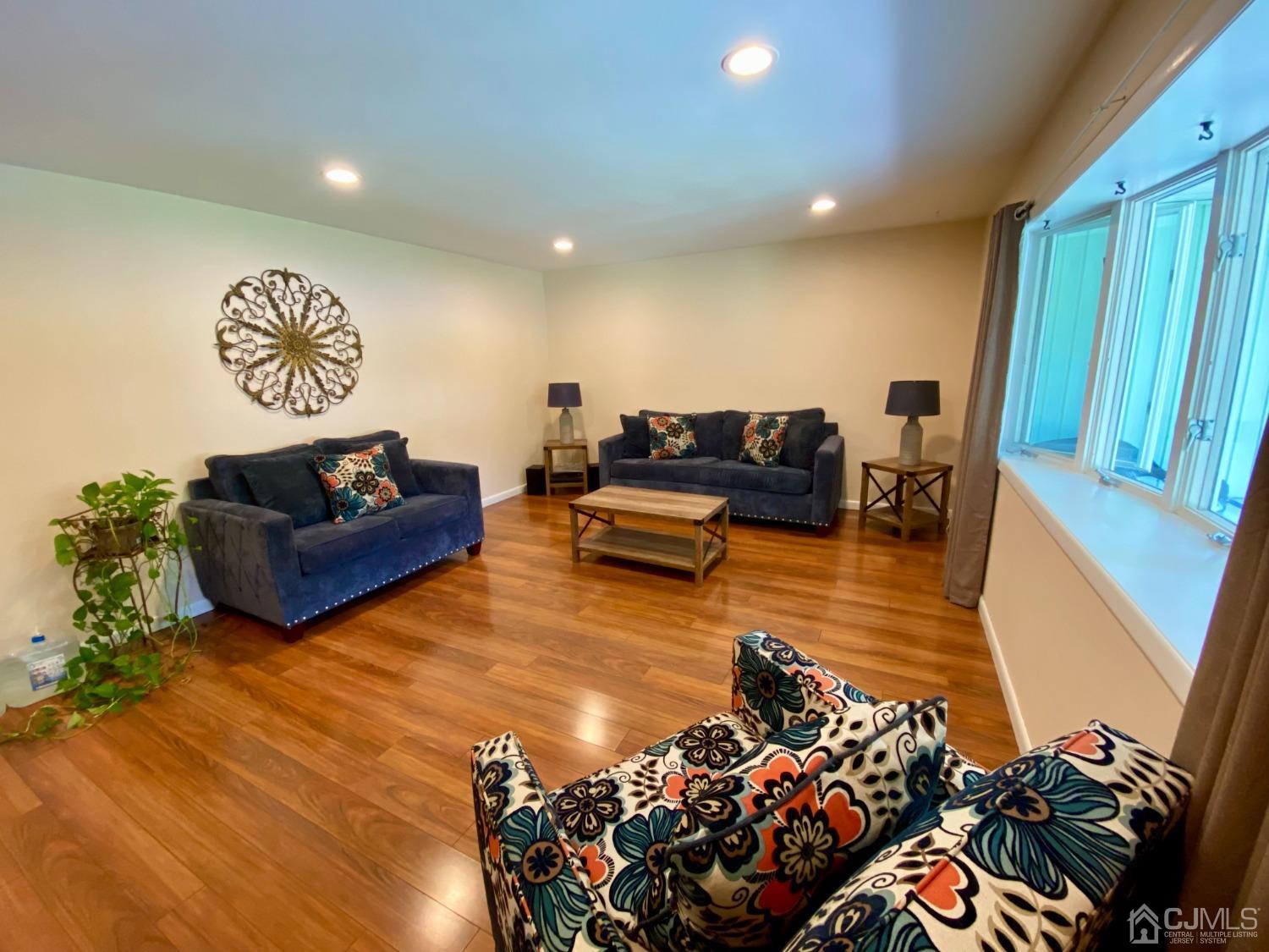 30 Woodland Road Franklin, NJ 07416 - Photo 5 of 34 a living room with furniture and a flat screen tv