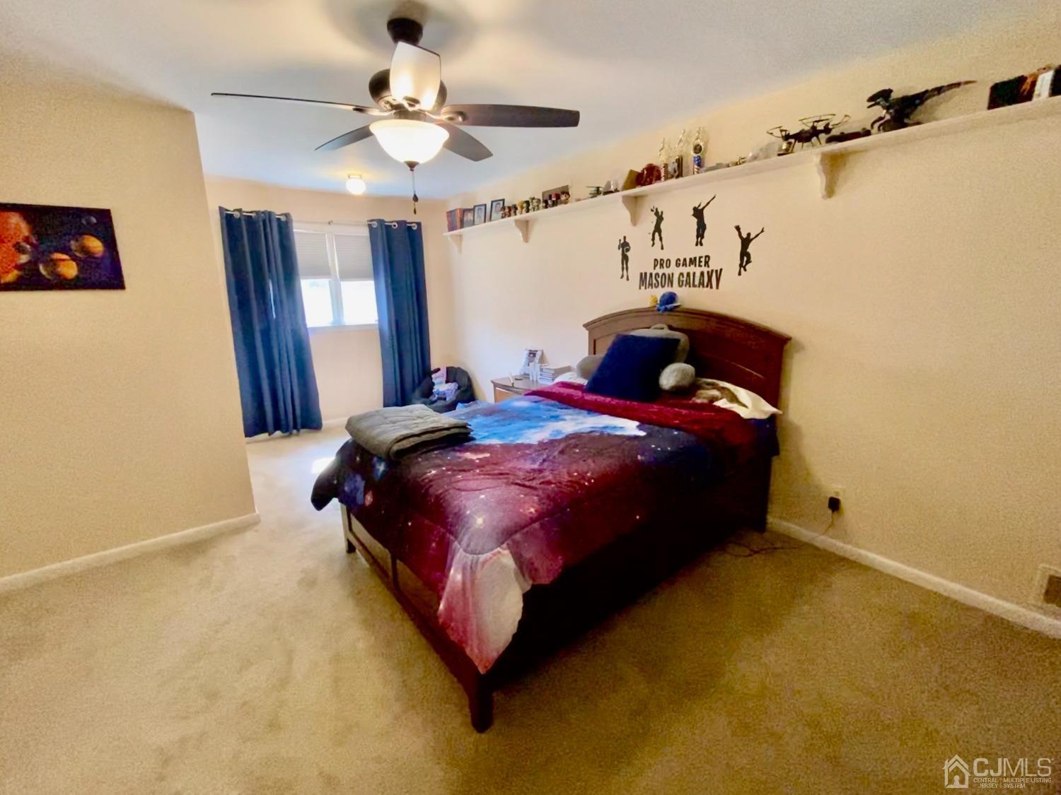 30 Woodland Road Franklin, NJ 07416 - Photo 7 of 34 a bedroom with a bed and a chandelier