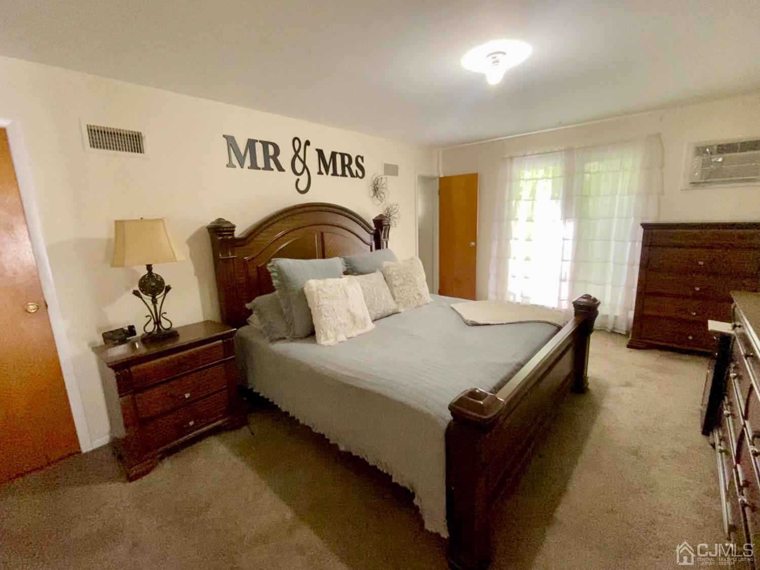 30 Woodland Road Franklin, NJ 07416 - Photo 8 of 34 a bedroom with a bed and a dresser
