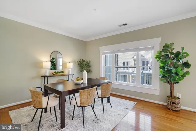 a dining room with furniture and a fireplace