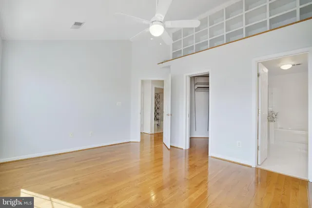 a bathroom with a bathtub shower sink vanity and toilet