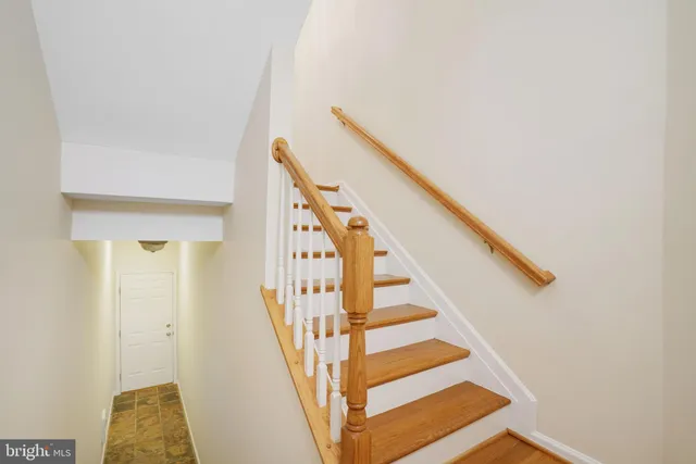 a living room with furniture wooden floor and a chandelier