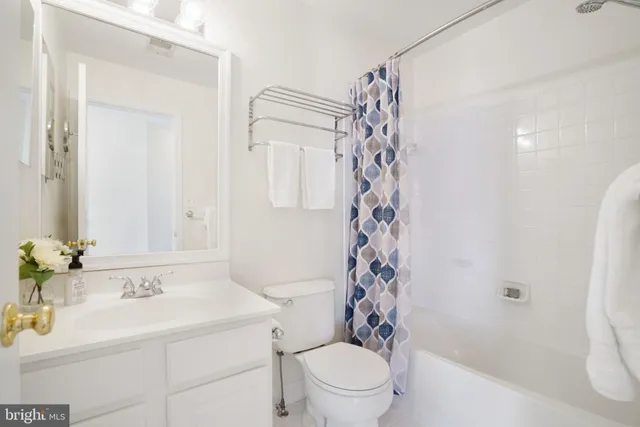 a view of washer and dryer with kitchen in the background