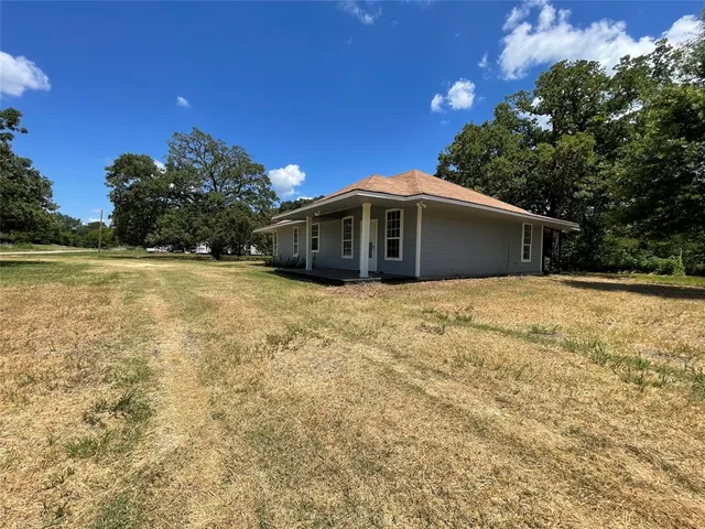 a view of backyard with green space