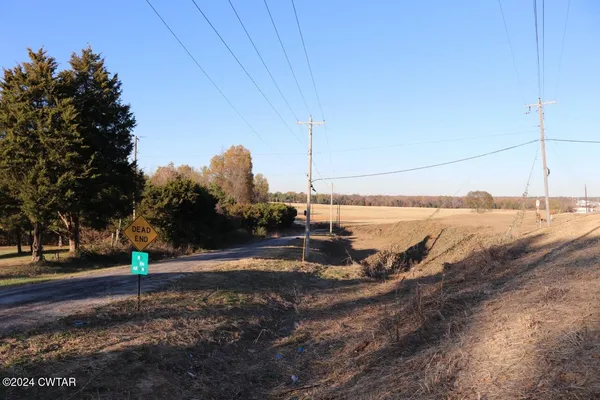 a view of a road with a building