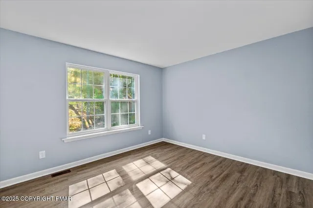 a bathroom with a sink double vanity and a toilet