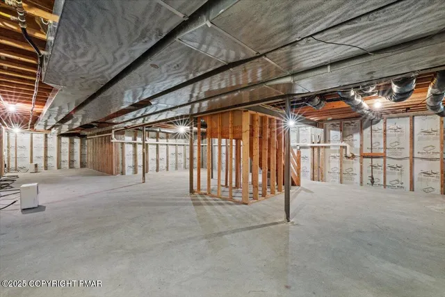 a view of a house with a big yard and large trees