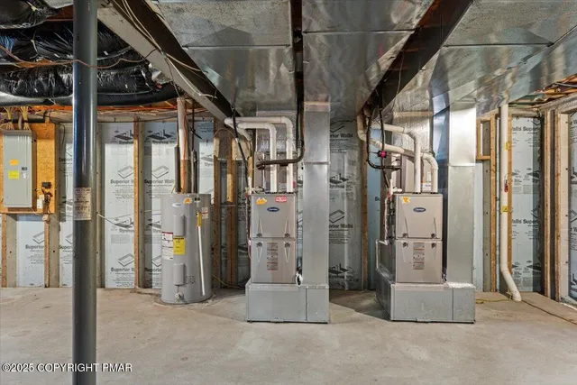 a front view of a house with a yard table and chairs